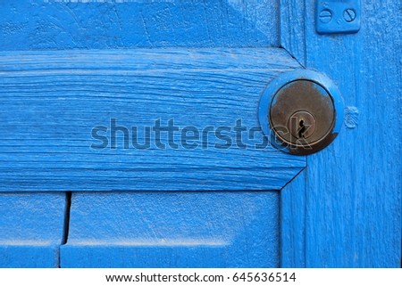 Close up Keyhole with Wood Blue Door.