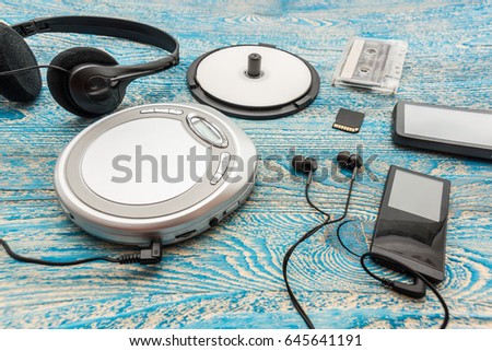 The photo shows a Cd player on a blue background