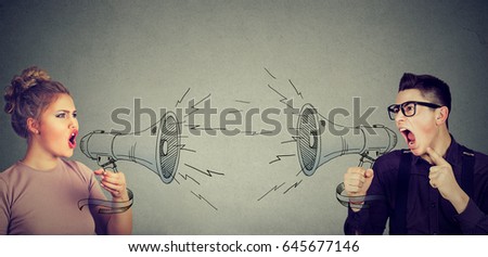 Quarrel between woman and man screaming at each other in megaphone  Royalty-Free Stock Photo #645677146