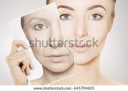young gorgeous woman breaks photo with her old face Royalty-Free Stock Photo #645704605