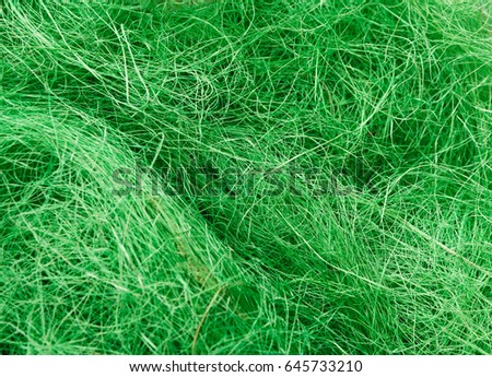 Green wool texture. Close-up of felt, natural fabric. Bright needlework background, handmade concept