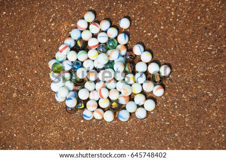 Glass beads.Crystal Ball. Children's toys. Royalty-Free Stock Photo #645748402