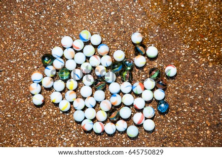 Glass beads.Crystal Ball. Children's toys. Royalty-Free Stock Photo #645750829