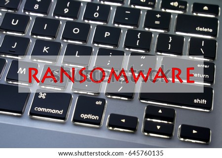 RANSOMWARE typed with laptop background concepts.