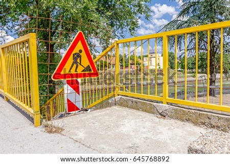 Closed enter at construction zone, work in progress, sign with boundary are symbols of caution, road resurfacing signal.