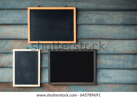 Clean chalk board on wooden wall for background. texture for educational or business background.