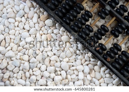black classic abacus on the white nature stone background