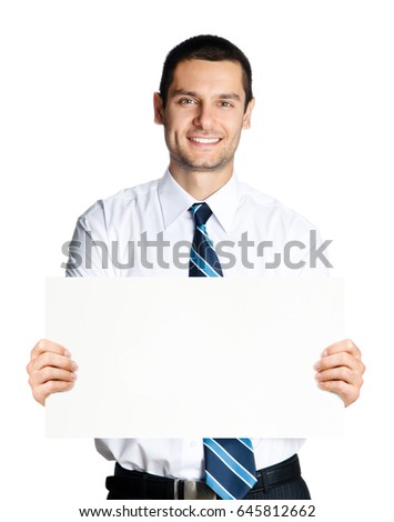 Portrait of happy smiling young business man showing blank signboard, isolated over white background
