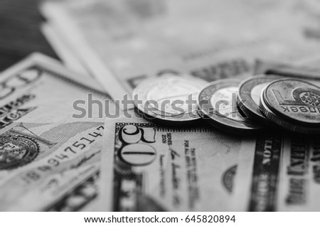 Dollars and euro banknotes on the table. Black and white photo