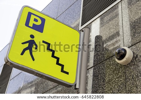 Sign of a ladder of a parking lot, detail of a signal of information for pedestrians
