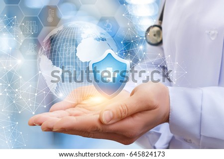 In the doctor's hands the symbol of health and the globe.