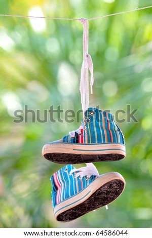 baby sneakers hanging outdoor