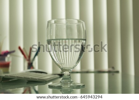 Glass of water on office desk