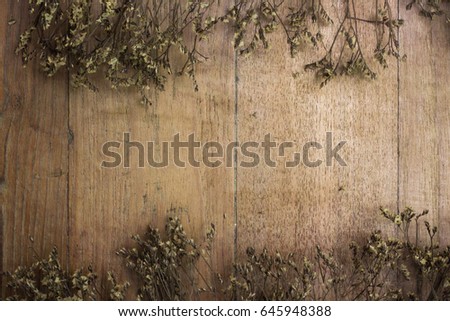 Dry flower on pattern of  old wooden texture background, Nature wall background with copy space, Wall background, Home decor and design
