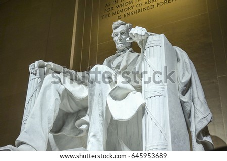 The statue of Abraham Lincoln sitting in a chair at Lincoln Memorial in Washington