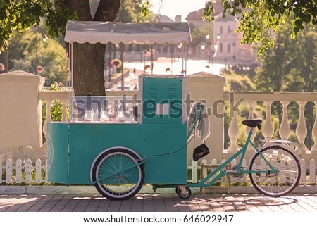Ice cream seller with bicycle on the street. Royalty-Free Stock Photo #646022947