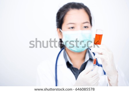 doctor holding drug vial on white background
