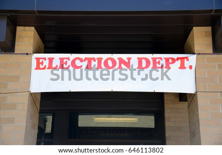 Banner hangs above entrance of an Election Department