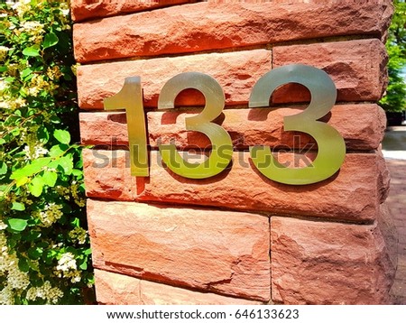 House number on the wall One hundred and thirty three 133