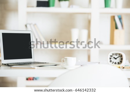 Bright office workplace with empty notebook, clock, coffee cup and other items. Blurry items in the background. Mock up