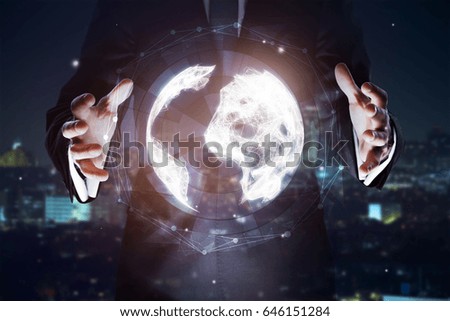Businessman holding abstract digital globe. Global business concept