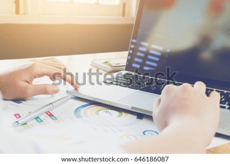 woman hand working laptop on desk in office. can be used on ad