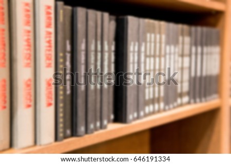 blur abstract background of wooden bookshelves.