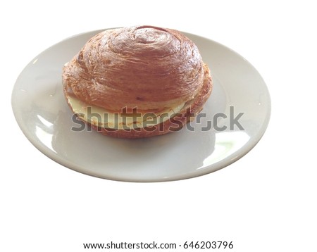 isolated croissant bun with fried egg on white plate