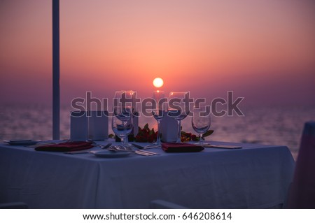 romantic dinner on the beach Royalty-Free Stock Photo #646208614