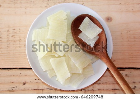 Sliced Aloe Vera on a white plate with a wooden spoon Royalty-Free Stock Photo #646209748