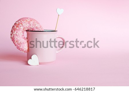 Donut in a pink coffee mug 