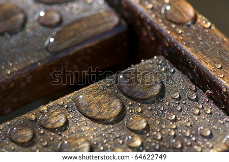 Water drops on outdoor furniture Royalty-Free Stock Photo #64622749