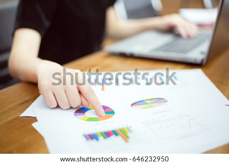 Business woman use computer laptop pointing to financial report at conference room. copy space. business people and technology concept.