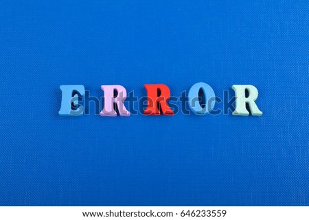 ERROR word on blue background composed from colorful abc alphabet block wooden letters, copy space for ad text. Learning english concept