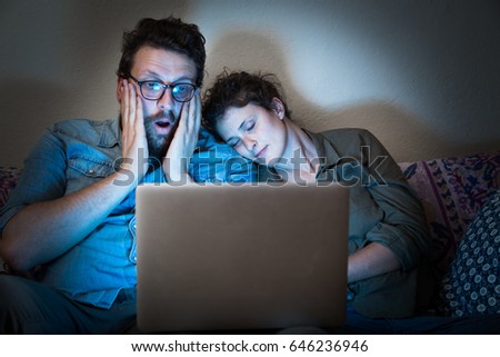 Young couple in front of the laptop