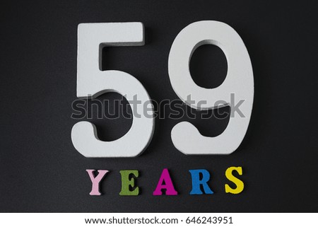 Letters and numbers to fifty-nine on a black isolated background.