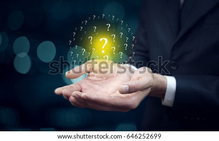 Question Marks with businessman on dark vintage background