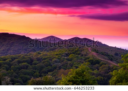 Sunset from Midsummer Hill Malverns on the Worcestershire and Herefordshire border one fine May evening Royalty-Free Stock Photo #646253233