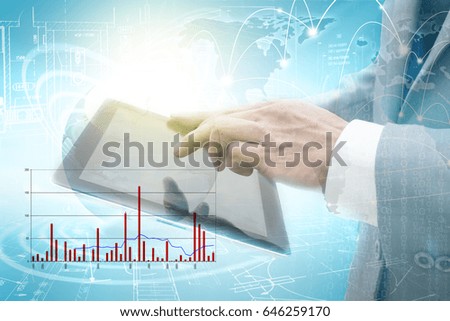 Business hand holding tablet,double exposure