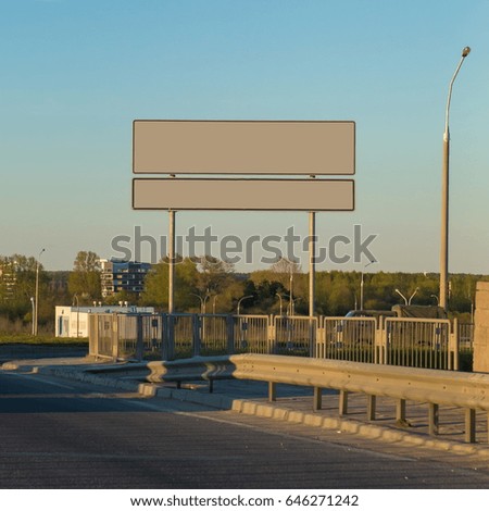 Background for design, billboards on city streets and along roadways at sunset