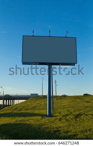 Background for design, billboards on city streets and along roadways at sunset