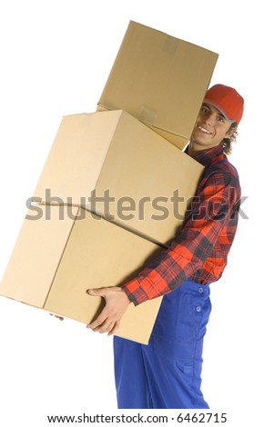 Smailing young man holding boxes. Isolated on white background. Side view