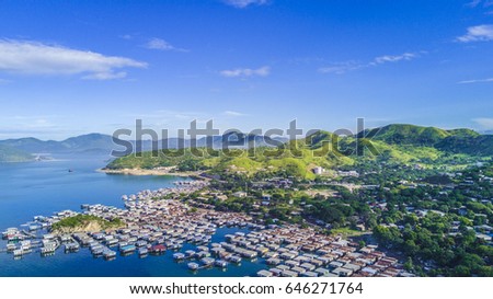 Floating fishing village in Papua New Guinea from the air Royalty-Free Stock Photo #646271764