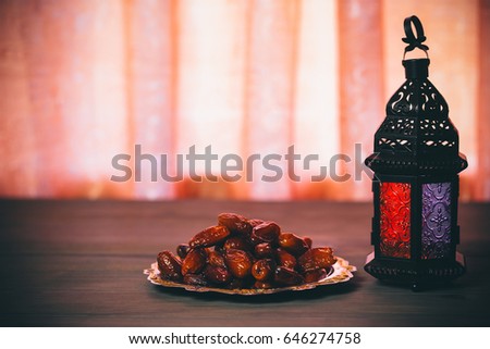 The Muslim feast of the holy month of Ramadan Kareem. Beautiful background with a shining lantern Fanus. Free space for your text Royalty-Free Stock Photo #646274758