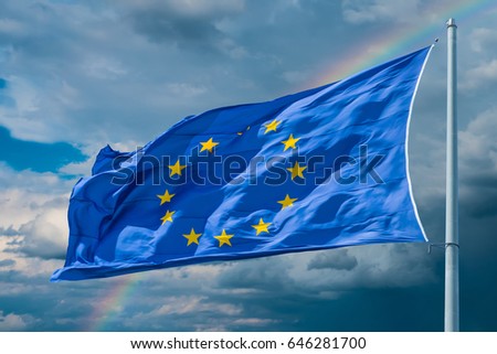 European Union flag on background of clouds