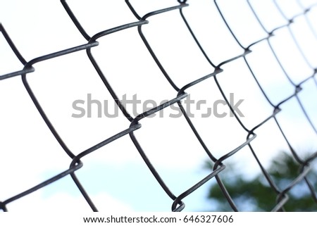 chain link wire fences enclose border area