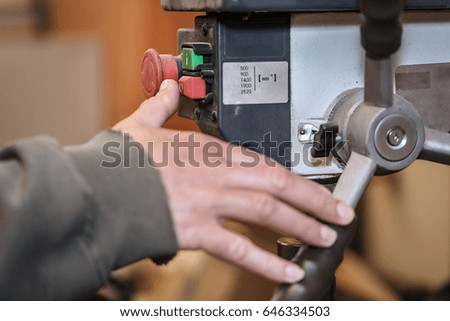 Close up photo of finger pressing OFF button