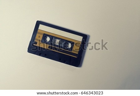 Audio, analog cassette tape. A music concept flat lay photo on a white background desk