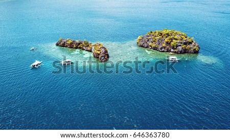 Aerial view of small islands with boats in Coron Bay. Palawan May 2017 Royalty-Free Stock Photo #646363780