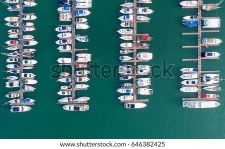 Pier speedboat. A marina lot. This is usually the most popular tourist attractions on the beach.Yacht and sailboat is moored at the quay.Aerial view by drone.Top view.